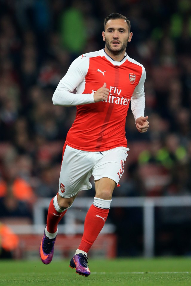 Lucas Perez, Arsenal soccer player, running on the field.