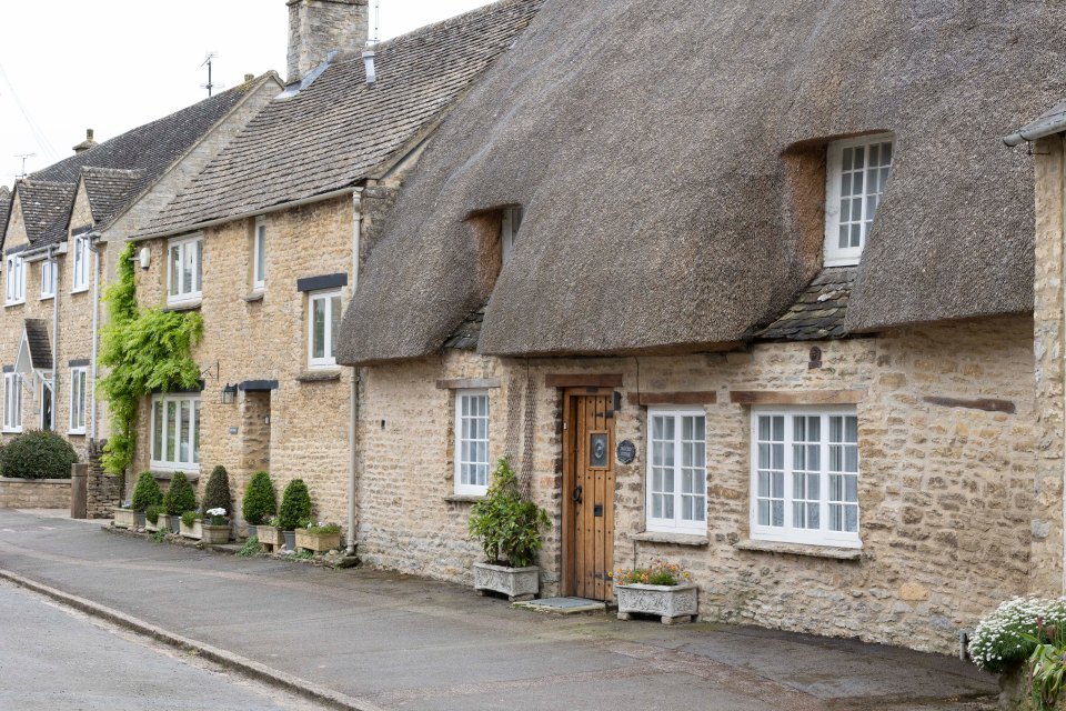 Stone houses in a West Oxfordshire village, a tourist destination.