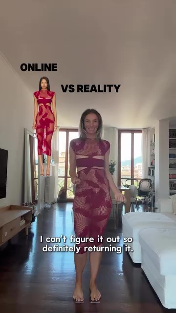 Woman comparing online and real-life views of a sheer dress.