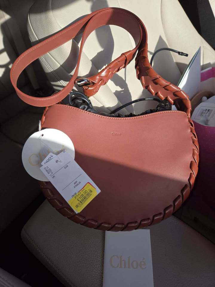 A brown Chloe handbag with a braided strap, significantly discounted.