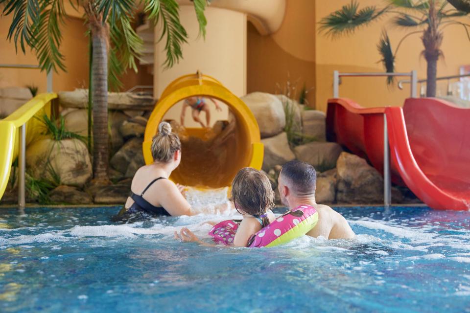 Family enjoying a water park.