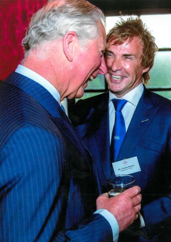 Prince Charles and Charlie Mullins laughing together.