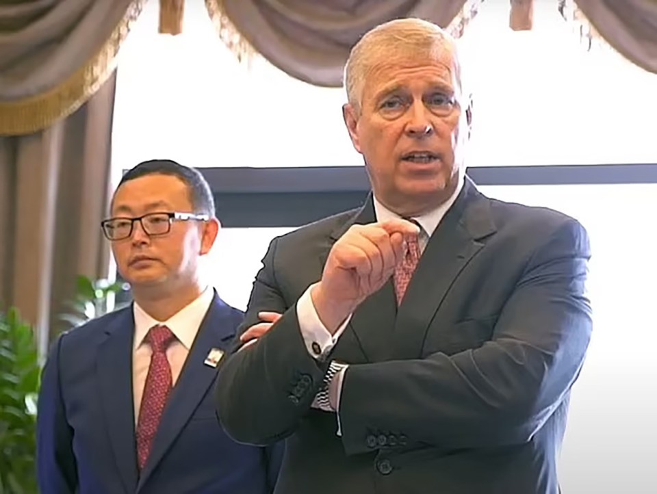 Prince Andrew speaking with Yang Tengbo.