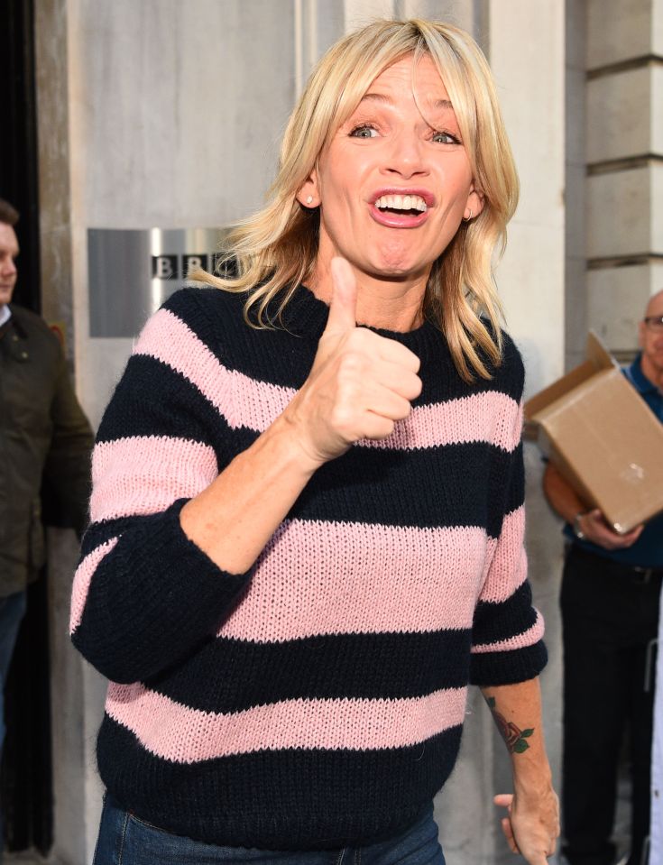 Zoe Ball giving a thumbs up outside BBC Broadcasting House.