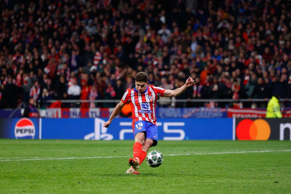 Julian Alvarez of Atletico de Madrid taking a penalty kick during a Champions League match.