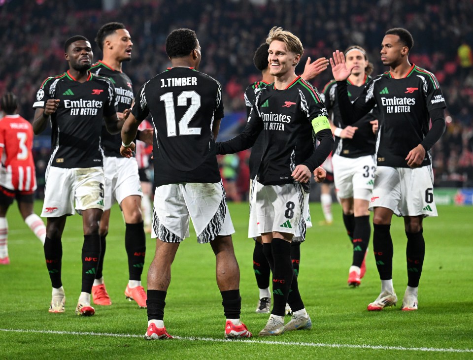 Arsenal players celebrating a goal.