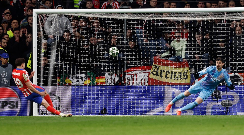 Julian Alvarez taking a penalty kick during a soccer match.