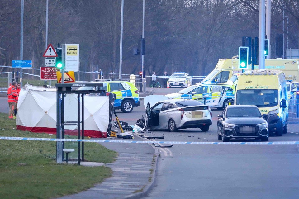 Photo of a fatal car accident scene with emergency vehicles and a forensic tent.