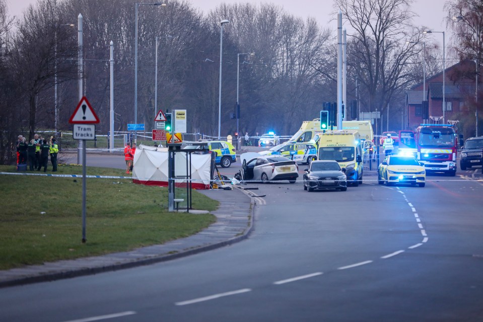 Fatal car accident scene with emergency responders.