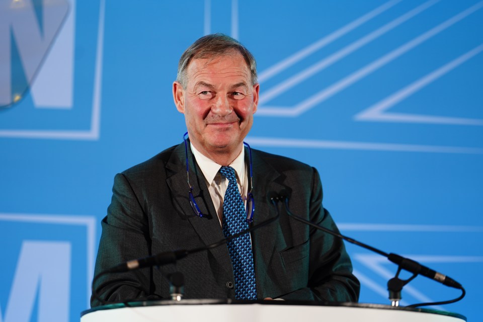 Photo of Rupert Lowe, Reform UK MP, at a podium.