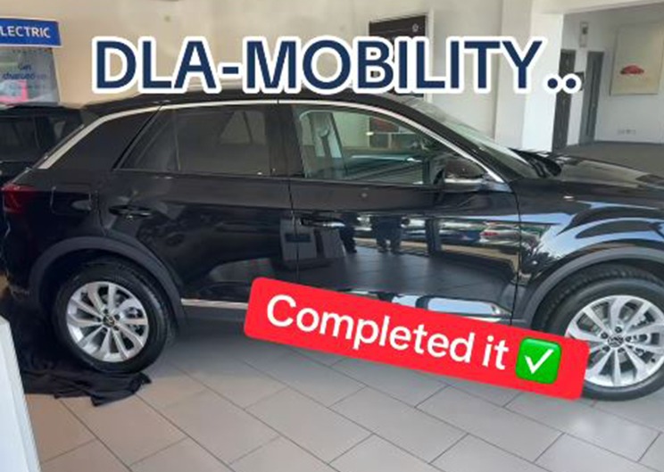 Black SUV with "DLA-MOBILITY. Completed it" text overlay.