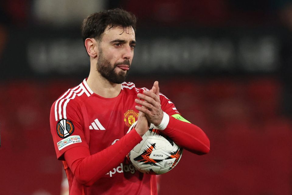 Manchester United's Portuguese midfielder #08 Bruno Fernandes applauds the fans following the UEFA Europa League Last 16 Second Leg football match between Manchester United and Real Sociedad at Old Trafford stadium in Manchester, north west England, on March 13, 2025. (Photo by Darren Staples / AFP) (Photo by DARREN STAPLES/AFP via Getty Images)