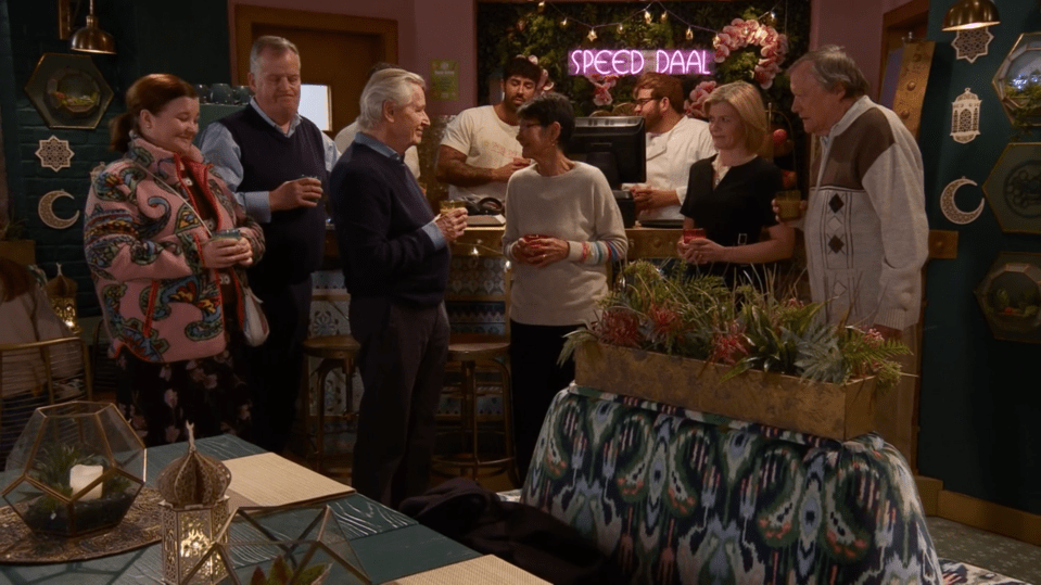 Screenshot of a group of people gathered in a restaurant.