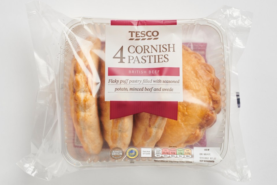 Four Tesco Cornish pasties in a plastic container.