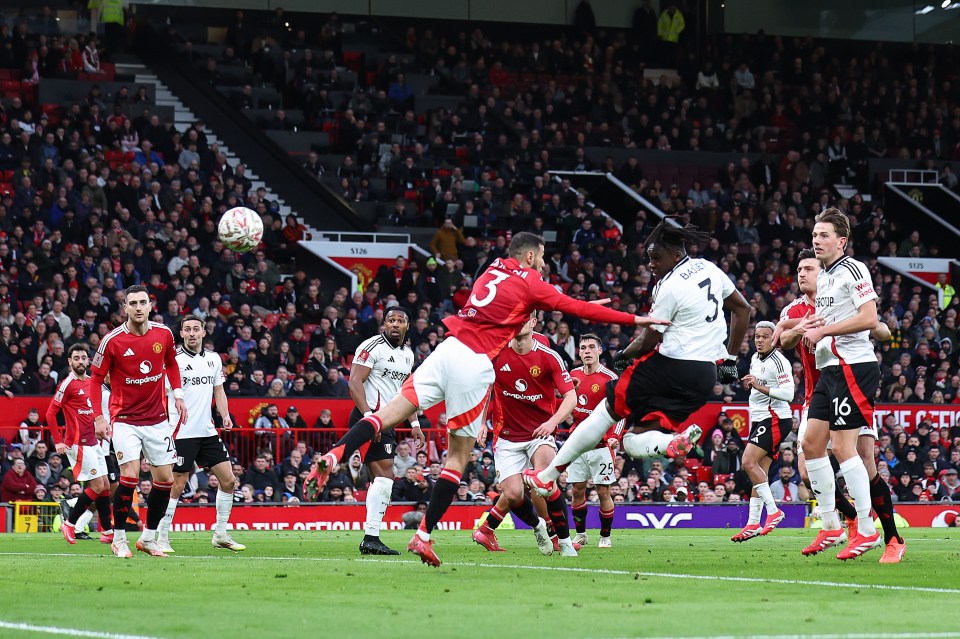 Calvin Bassey of Fulham scoring a goal during a soccer match.