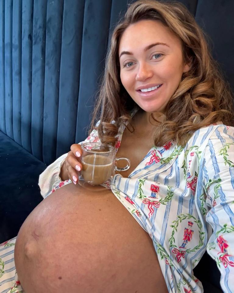 Pregnant woman holding a cup of coffee.