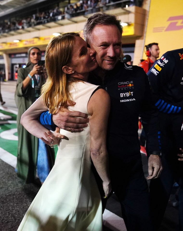 Christian and Geri Horner embracing after a Formula 1 race.