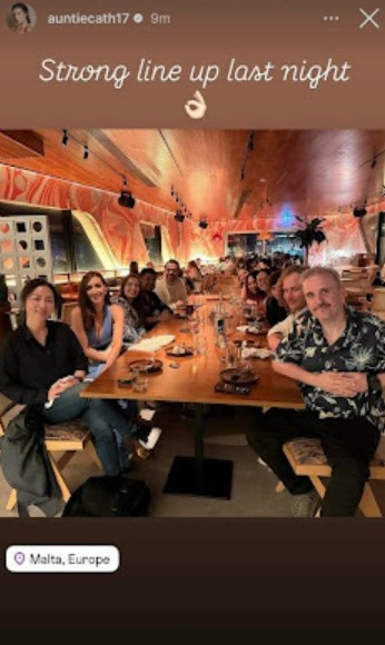 Group of actors at a restaurant table in Malta.