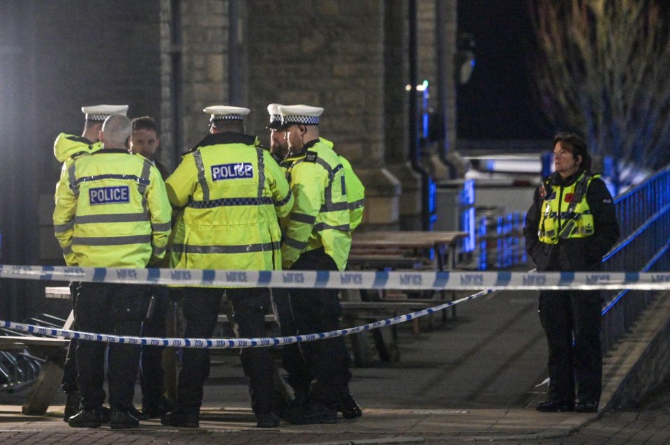 Police officers at a crime scene.