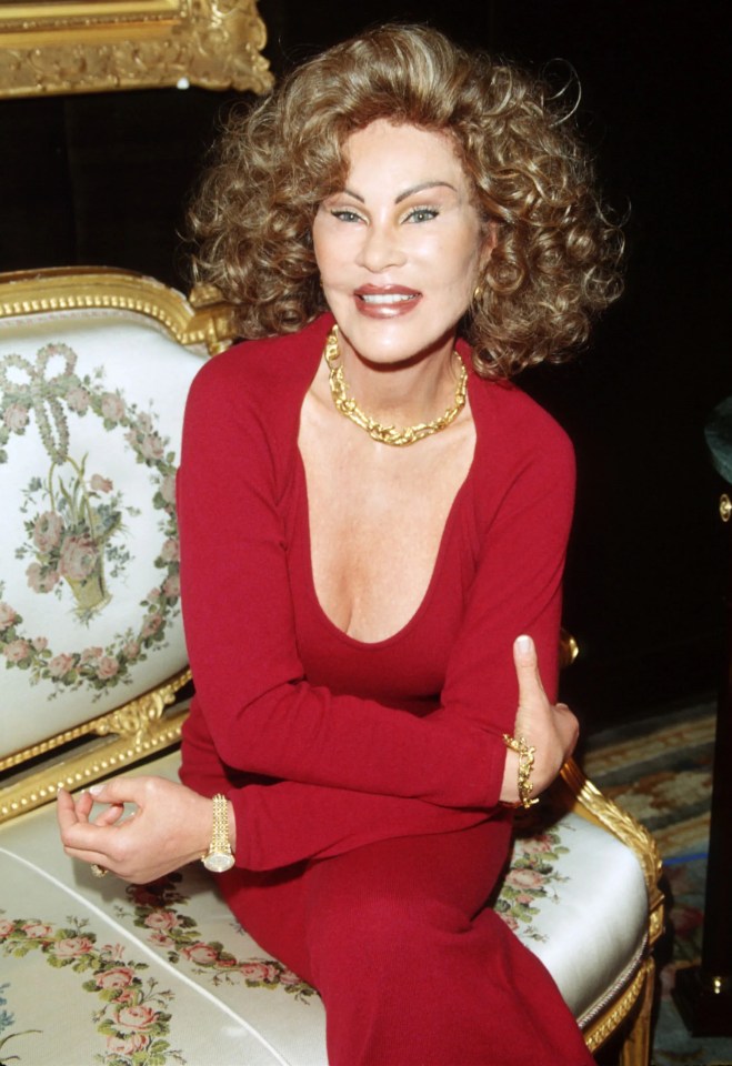 Jocelyne Wildenstein in a red dress, wearing gold jewelry.