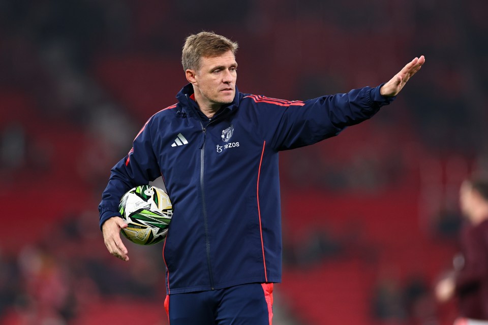 Darren Fletcher, Manchester United first-team coach, holding a soccer ball.