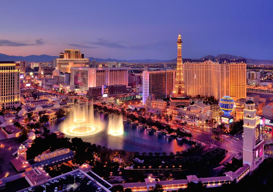 Night view of the Las Vegas Strip, featuring the Bellagio fountains.