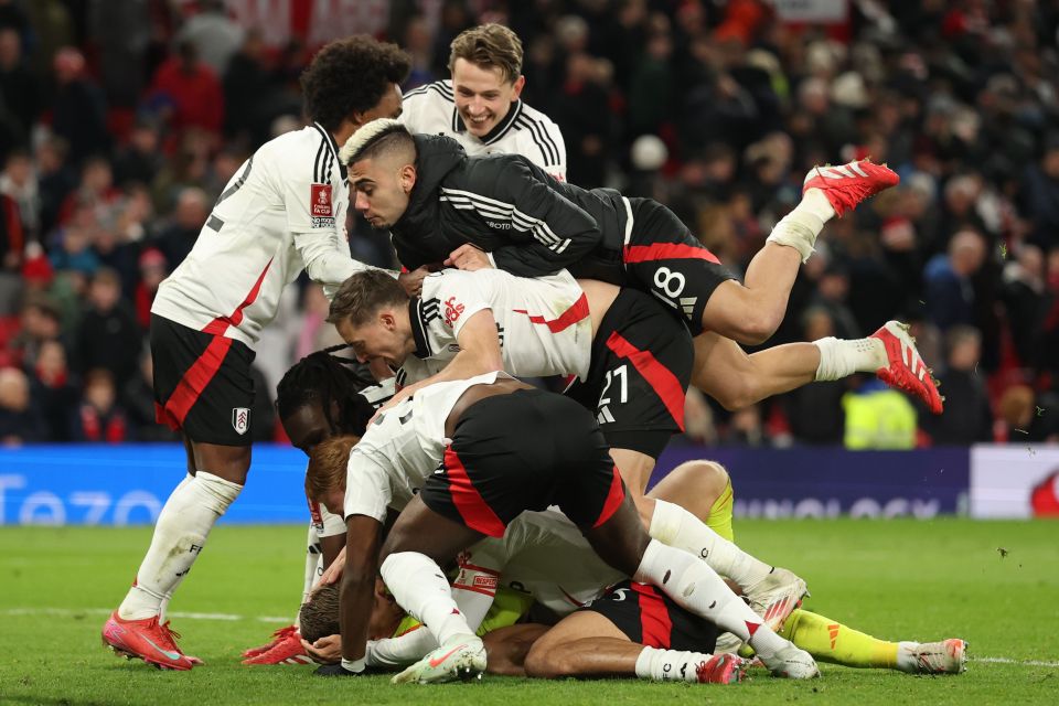 Soccer players celebrating a goal.