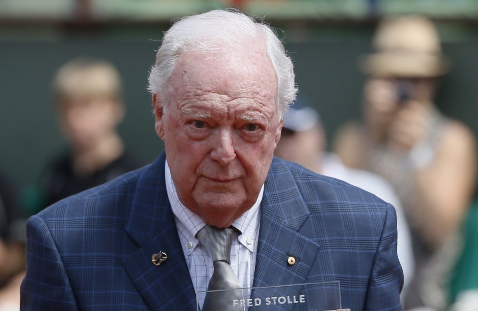 Fred Stolle receiving an award at the French Open.