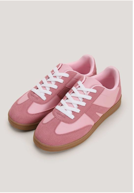 Pair of pink sneakers with white laces.