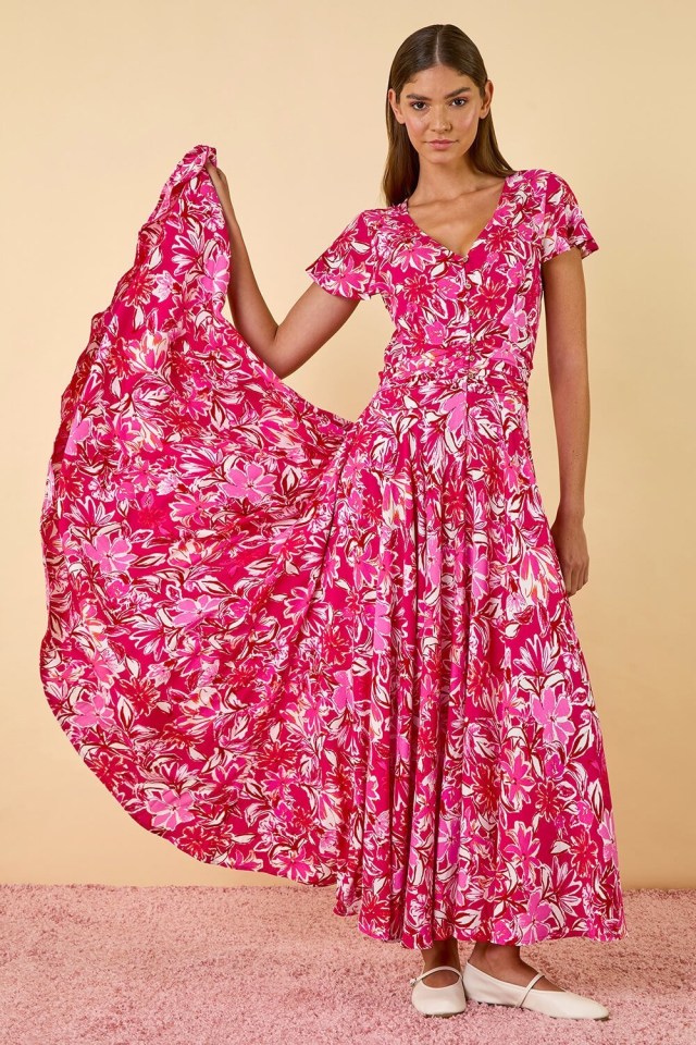 Model wearing a pink floral maxi dress.