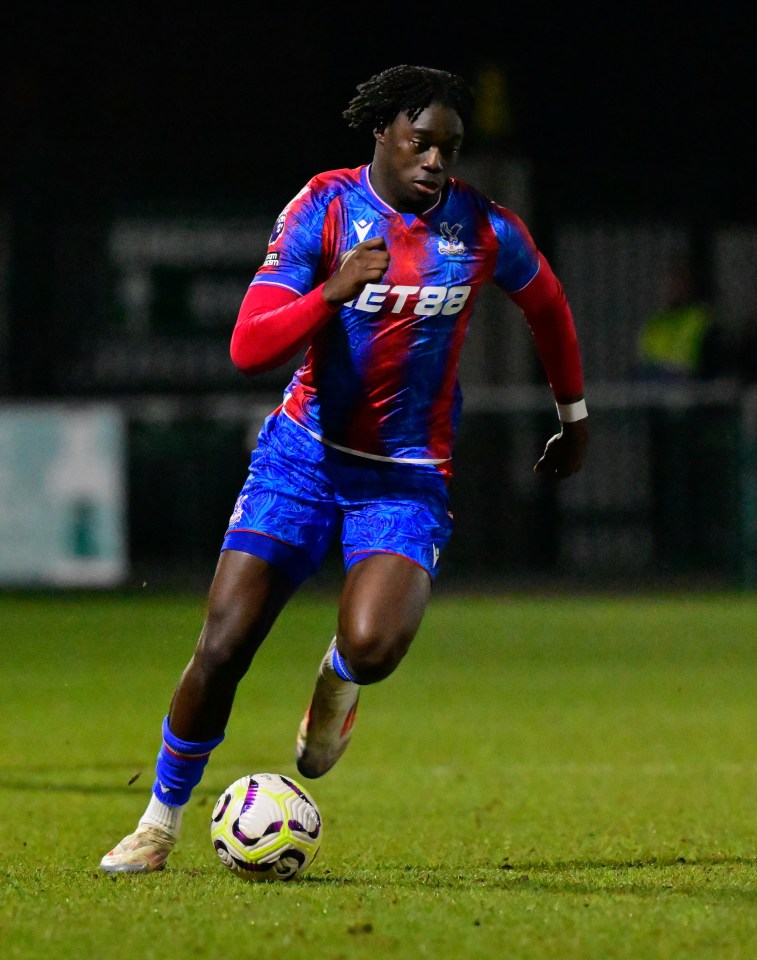 Hindolo Mustapha of Crystal Palace U21s dribbling the soccer ball.