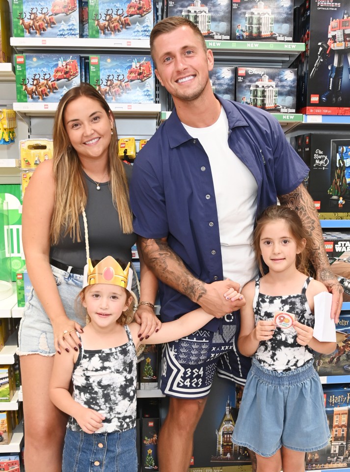 Jacqueline Jossa, Mia Osborne, Dan Osborne, and Ella Osborne at the LEGO Flagship Store reopening.