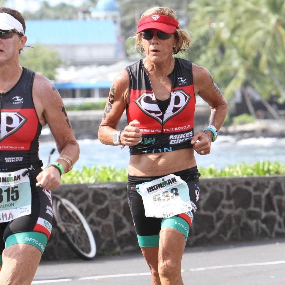 Two women running a triathlon.