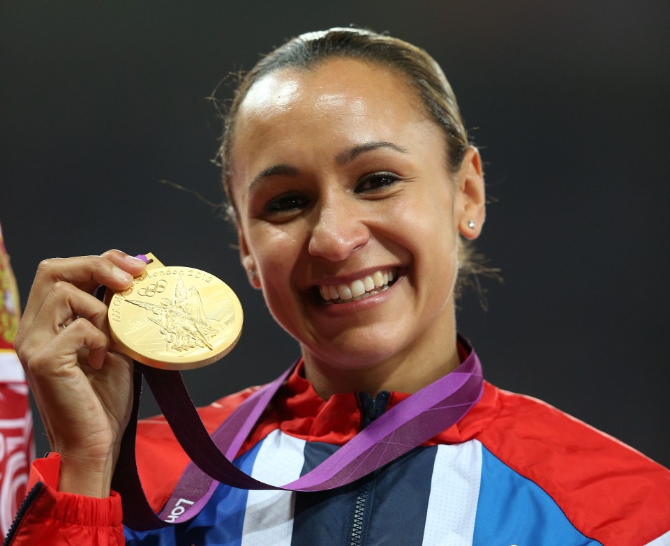 Jessica Ennis holding her gold medal at the Olympics.