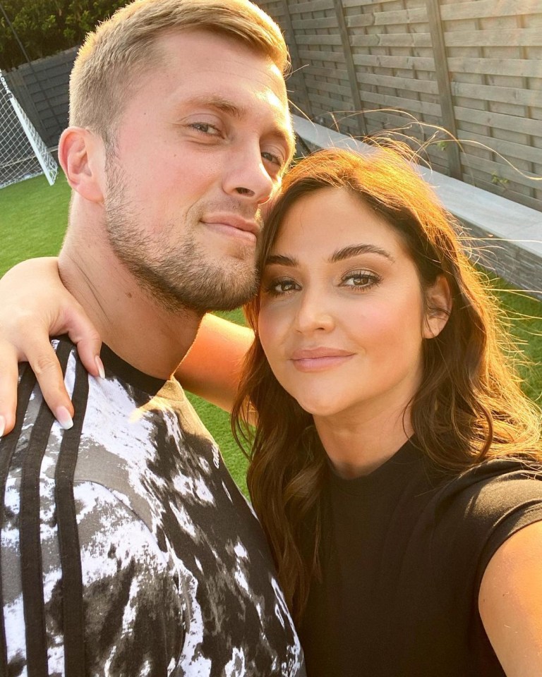 Jacqueline Jossa and Dan Osborne embracing.