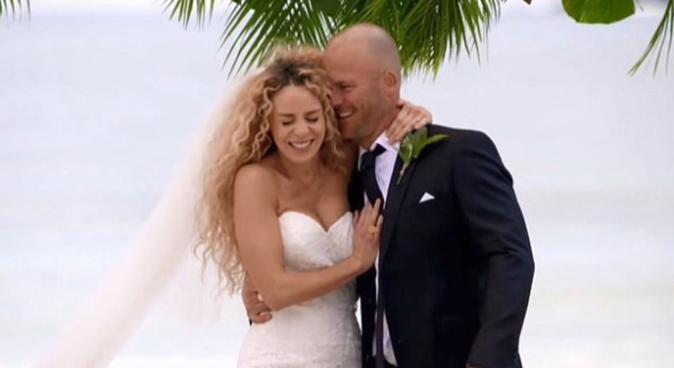 A bride and groom embracing on their wedding day.