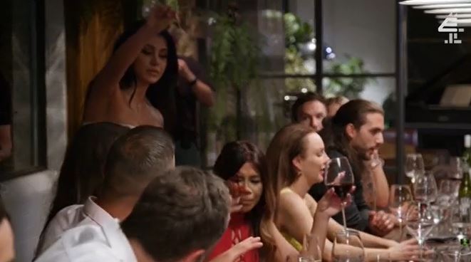 Screenshot of a dinner party scene from Married at First Sight Australia.