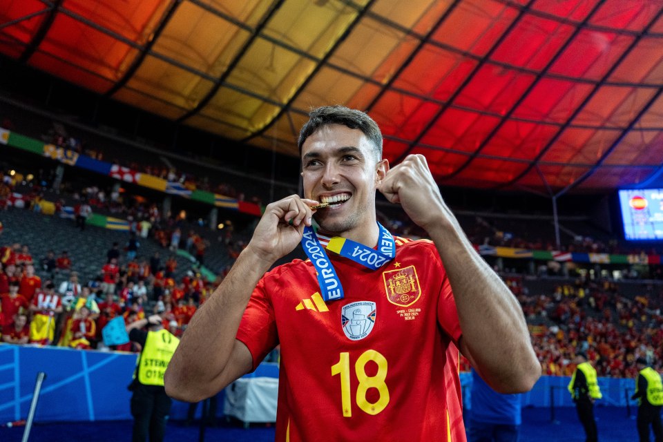 Martin Zubimendi of Spain celebrates with a medal after winning the UEFA EURO 2024 final.