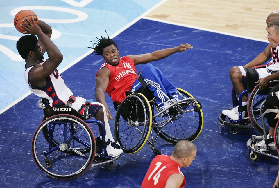 Paralympic wheelchair basketball players in action.