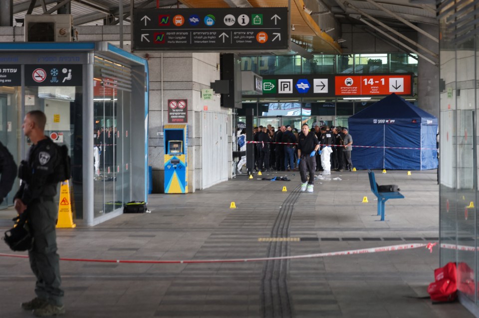 Israeli security and emergency services at the scene of a stabbing attack at a bus station.