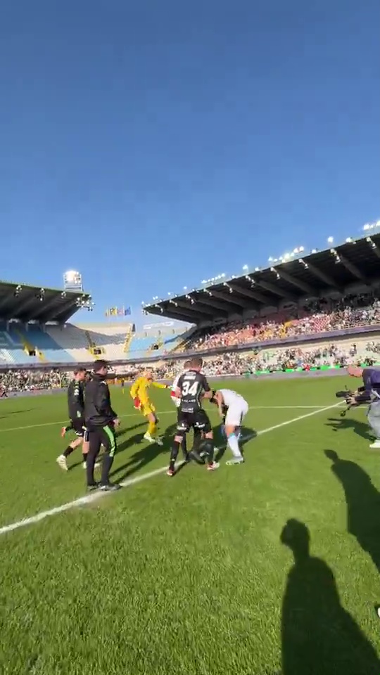 Soccer players involved in a brawl on the field.