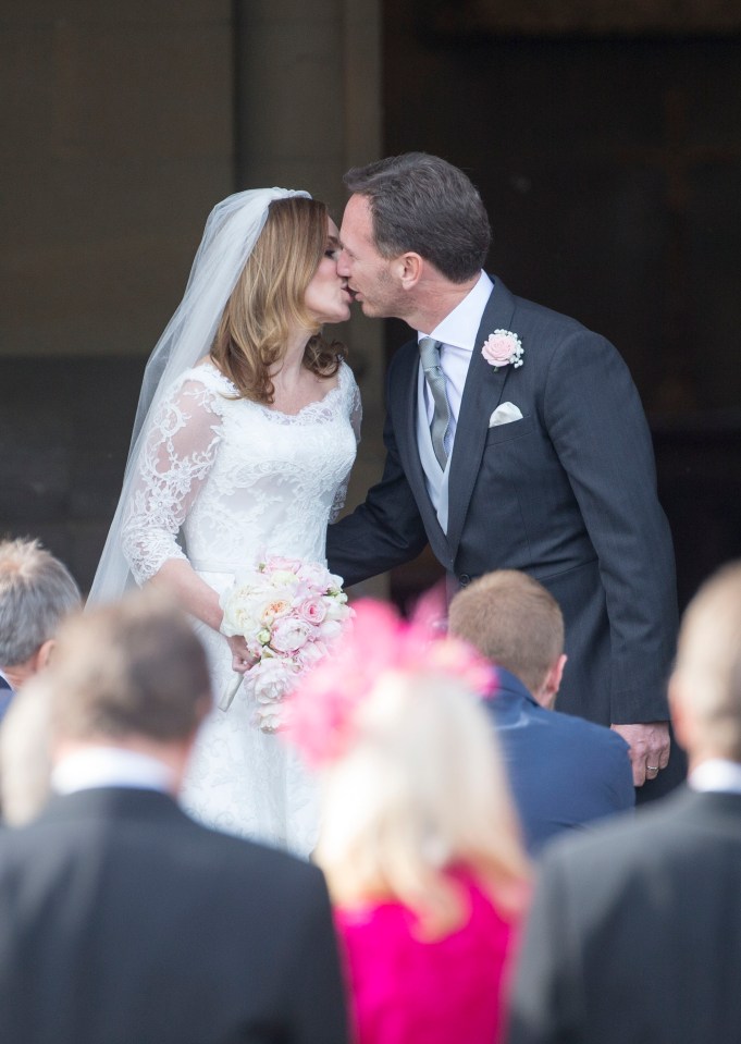 Bride and groom kissing after wedding ceremony.