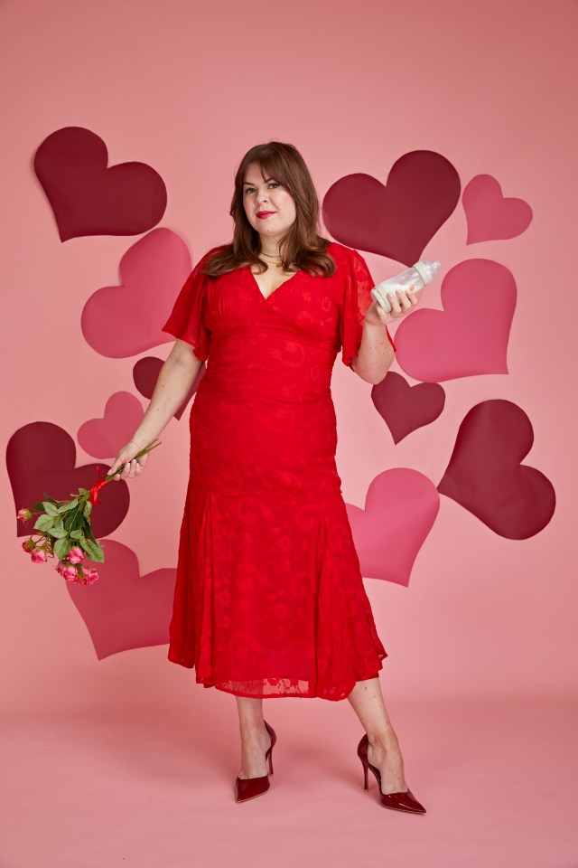 Woman in red dress holding baby bottle and roses against pink background with hearts.