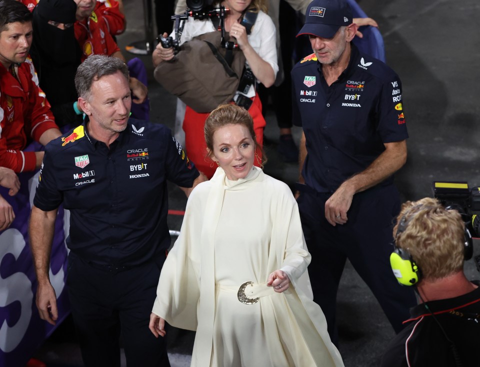 Christian Horner, Geri Horner, and Adrian Newey at a Formula 1 podium ceremony.