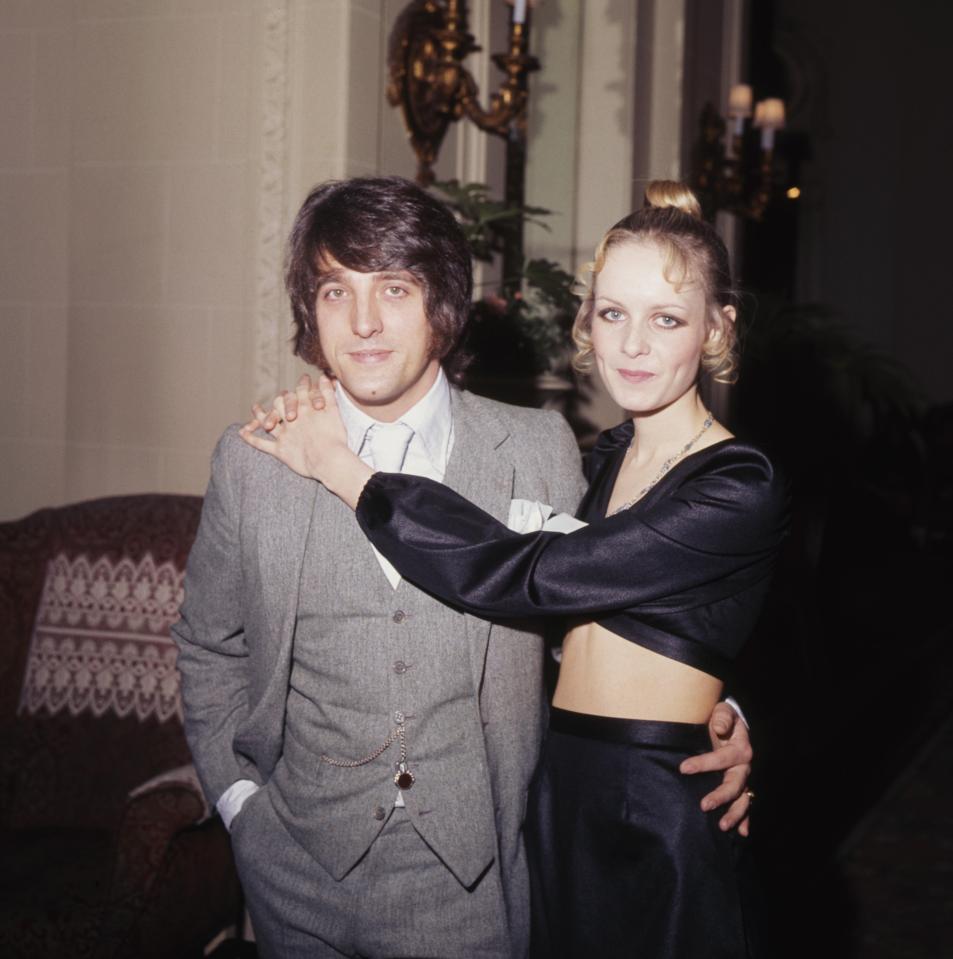 Twiggy and a man in suits at the Ritz, London.