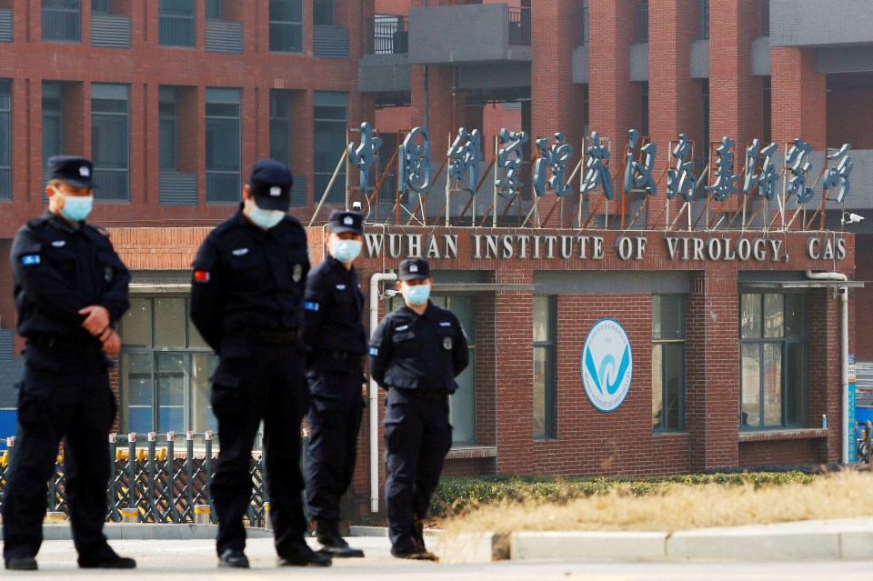 Security personnel outside the Wuhan Institute of Virology.