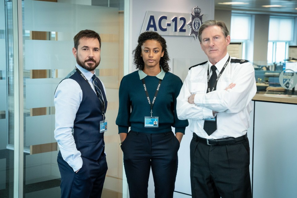 Three police officers in a Line of Duty scene.