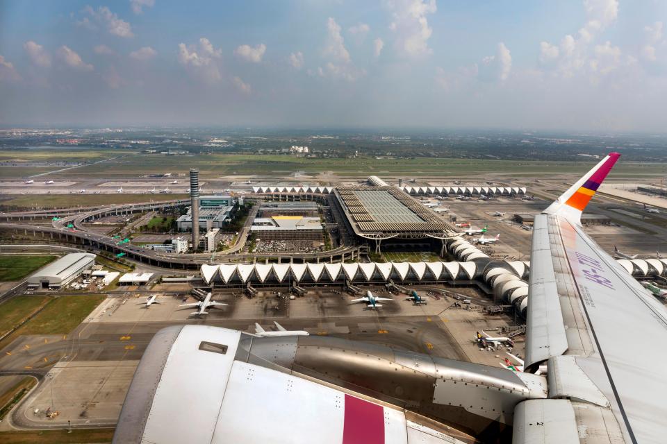 Aerial view of Suvarnabhumi Airport in Bangkok, Thailand, from a departing airplane.